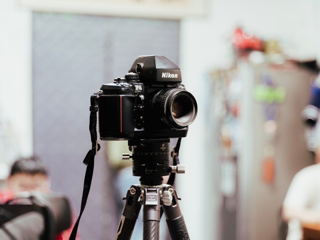 Professional cinema video camera on tripod in studio